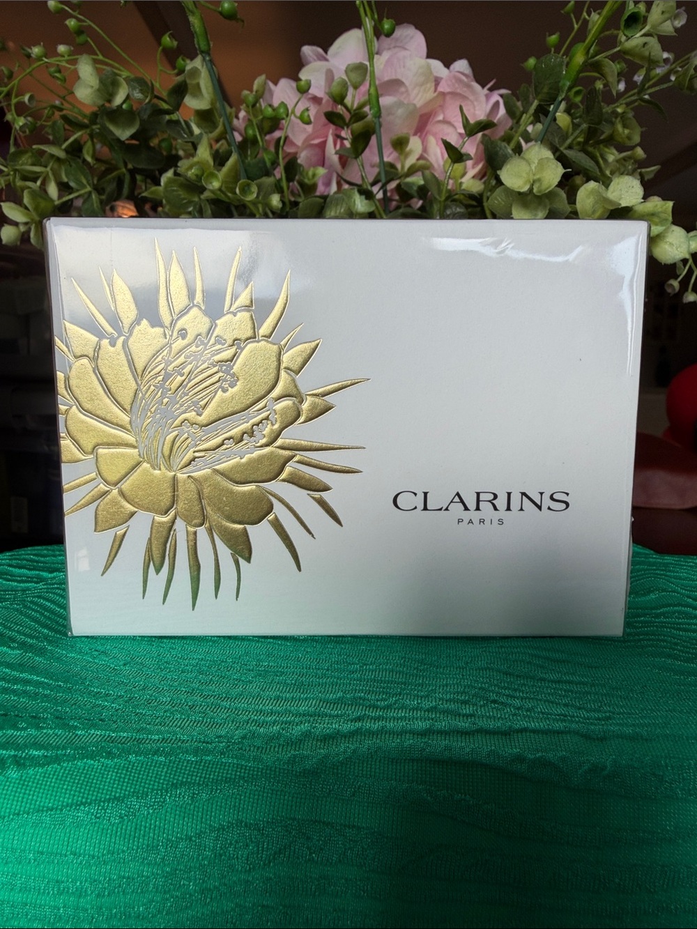 Clarins White Box with Gold Floral Emblem